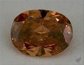 fancy deep brownish orange oval